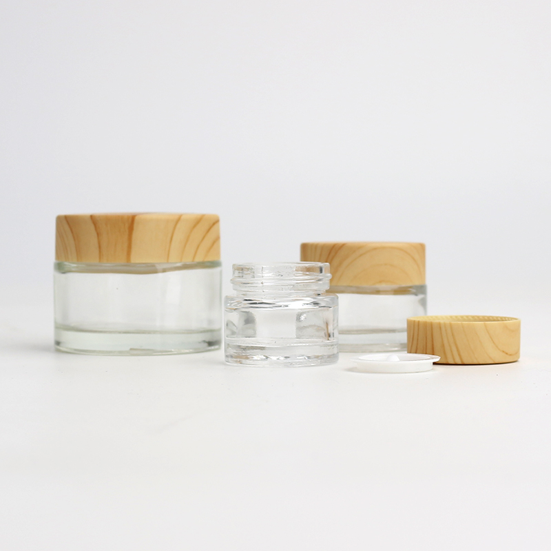 Wholesale Cosmetic 5g 10g 15g 20g 30g 50g 60g 100g clear frosted glass jar wood bamboo grain plastic cover with plastic inner
