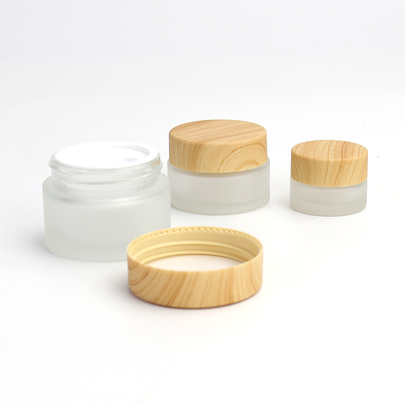 Wholesale Cosmetic 5g 10g 15g 20g 30g 50g 60g 100g clear frosted glass jar wood bamboo grain plastic cover with plastic inner