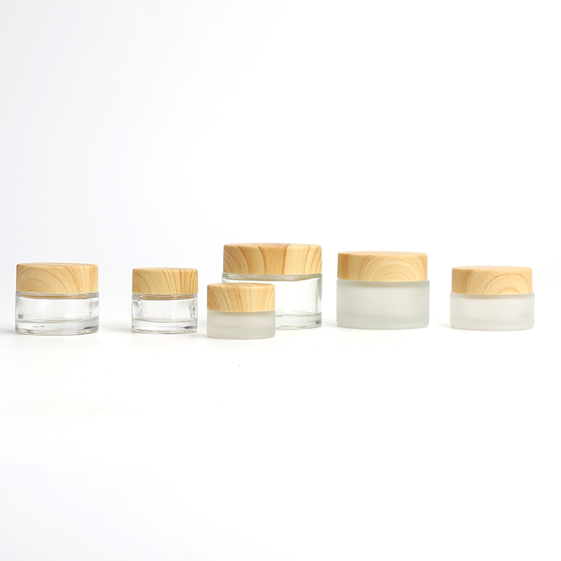 Wholesale Cosmetic 5g 10g 15g 20g 30g 50g 60g 100g clear frosted glass jar wood bamboo grain plastic cover with plastic inner