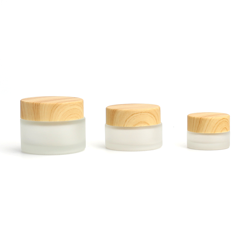 Wholesale Cosmetic 5g 10g 15g 20g 30g 50g 60g 100g clear frosted glass jar wood bamboo grain plastic cover with plastic inner