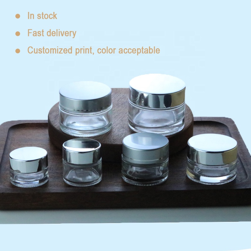 Wholesale Custom Small Round Packaging 1oz Glass Jar Clear With UV Silver Lid (GJM03)