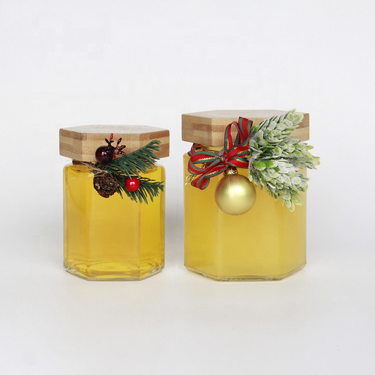 Wholesale Customized Hexagon Shaped 100ml 200ml Empty Clear Hexagonal Honey Jar Glass with Wooden Lid