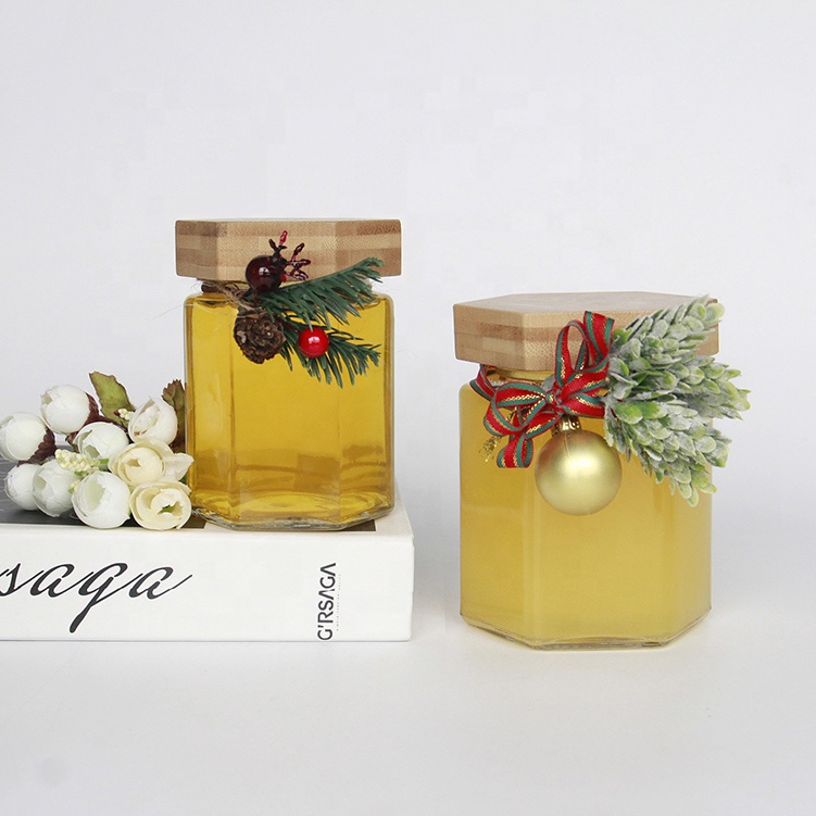 Wholesale Customized Hexagon Shaped 100ml 200ml Empty Clear Hexagonal Honey Jar Glass with Wooden Lid