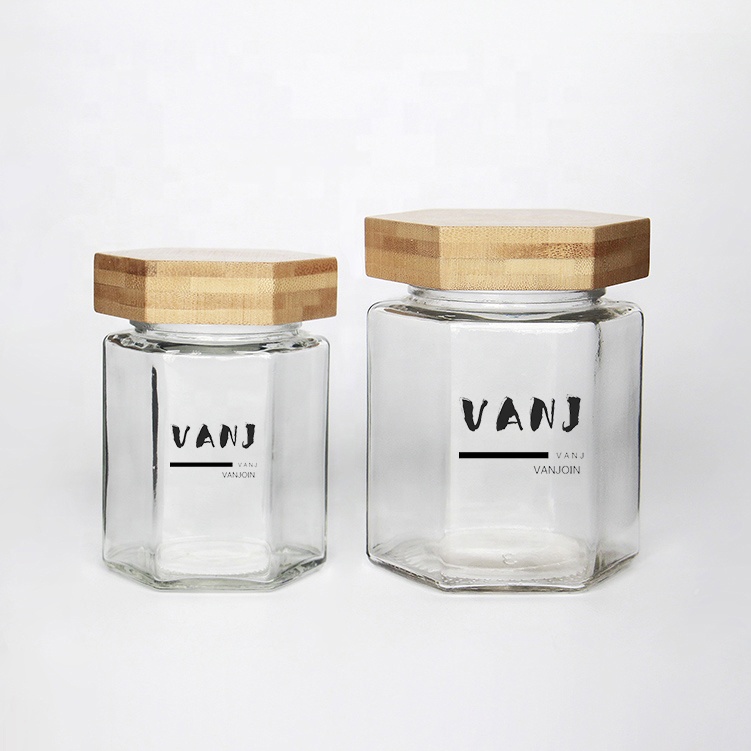 Wholesale Customized Hexagon Shaped 100ml 200ml Empty Clear Hexagonal Honey Jar Glass with Wooden Lid