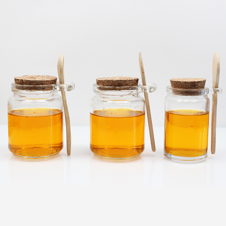Wholesale Delicate honey glass jar 250ml glass jar with wooden lid and spoon