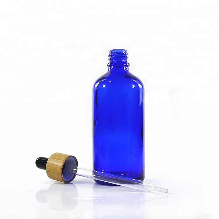 Wholesale Eco friendly clear amber green blue 5ml 10ml 15ml 20ml 30ml 50ml 100ml glass dropper bottle with bamboo cap