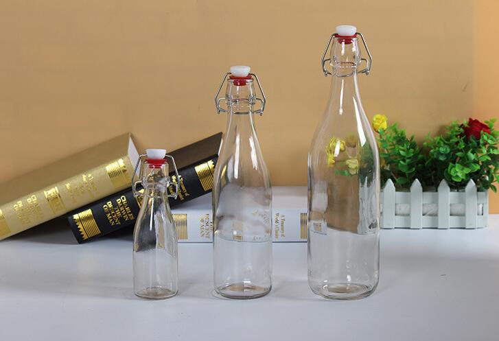 Wholesale Factory price 500ml Empty Clear Drinking Beverage Container Glass Bottle glass swing top bottle550ml 1228