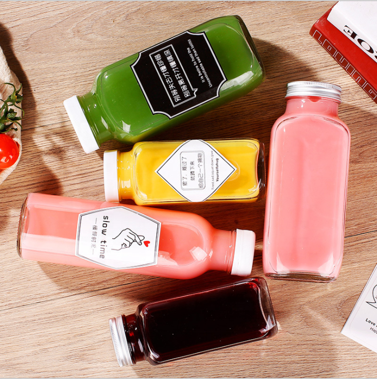 Wholesale Fashion Bulk Empty Carbonated Beverage Cold Pressing Juice Milk Tea Glass Bottles