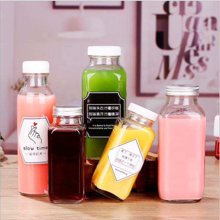 Wholesale Fashion Bulk Empty Carbonated Beverage Cold Pressing Juice Milk Tea Glass Bottles