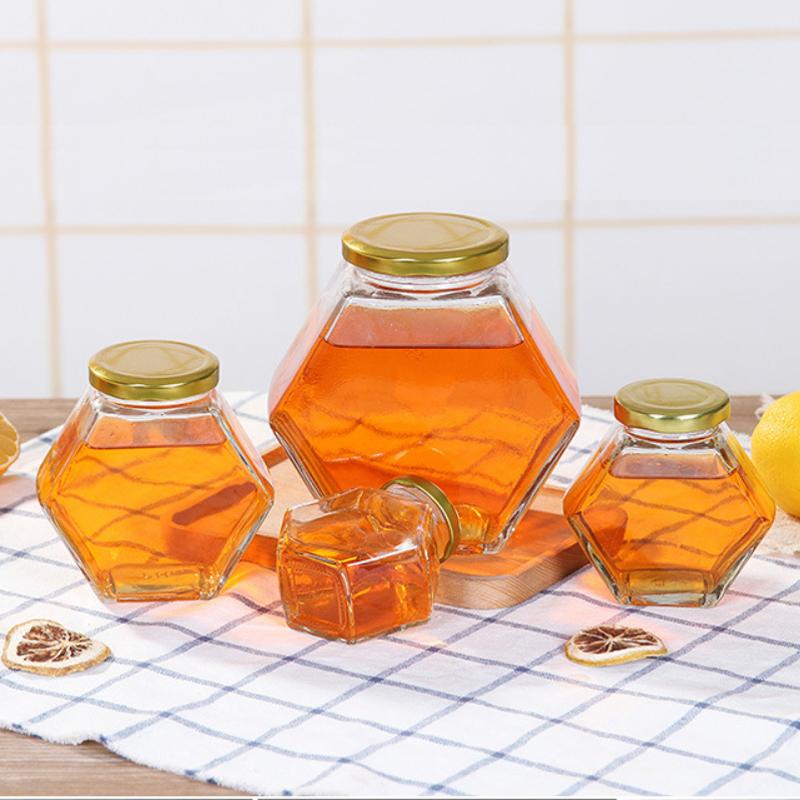 Wholesale Hexagonal Glass Honey Container Honey Storage Bottle Glass Honey Jar With Matel Lid