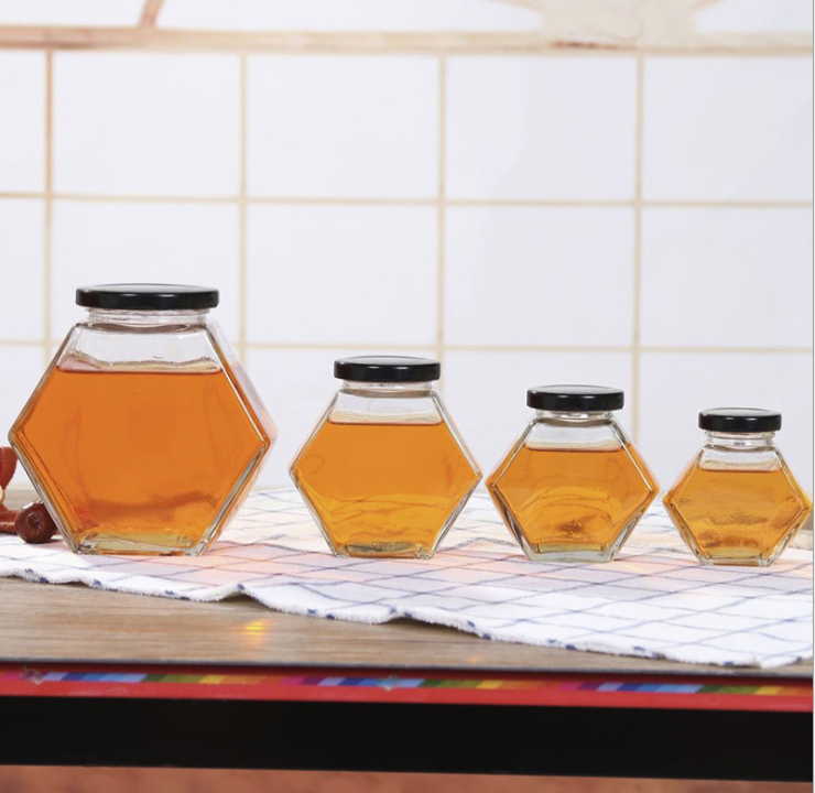 Wholesale Hexagonal Glass Honey Container Honey Storage Bottle Glass Honey Jar With Matel Lid