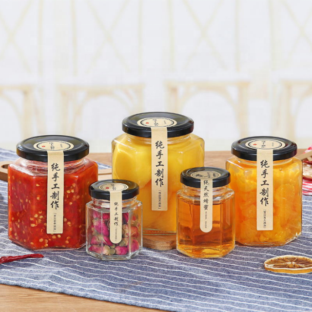 Wholesale Hexagonal Glass Honey Container Honey Storage Bottle Glass Honey Jar With Metal Lid