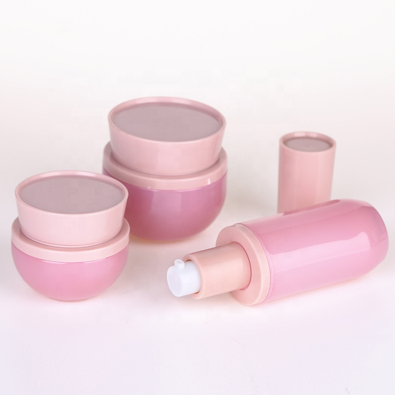 Wholesale High-grade pink ABS cap pink glass cosmetic bottle and jar cosmetic container package for personal care production