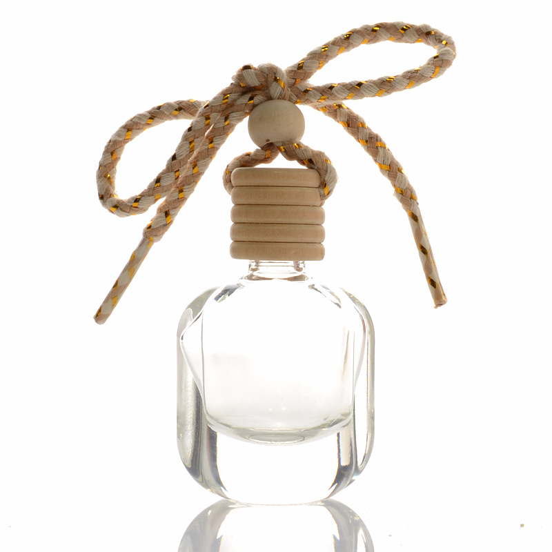 Wholesale Hot Sale 10ml Hanging Wooden Cover Transparent Glass Car Aromatherapy Perfume Bottle