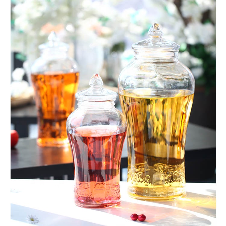 Wholesale Large Embossing Ginseng Fruit Wine Glass Bottle Seal Glass Storage Jars With Tap