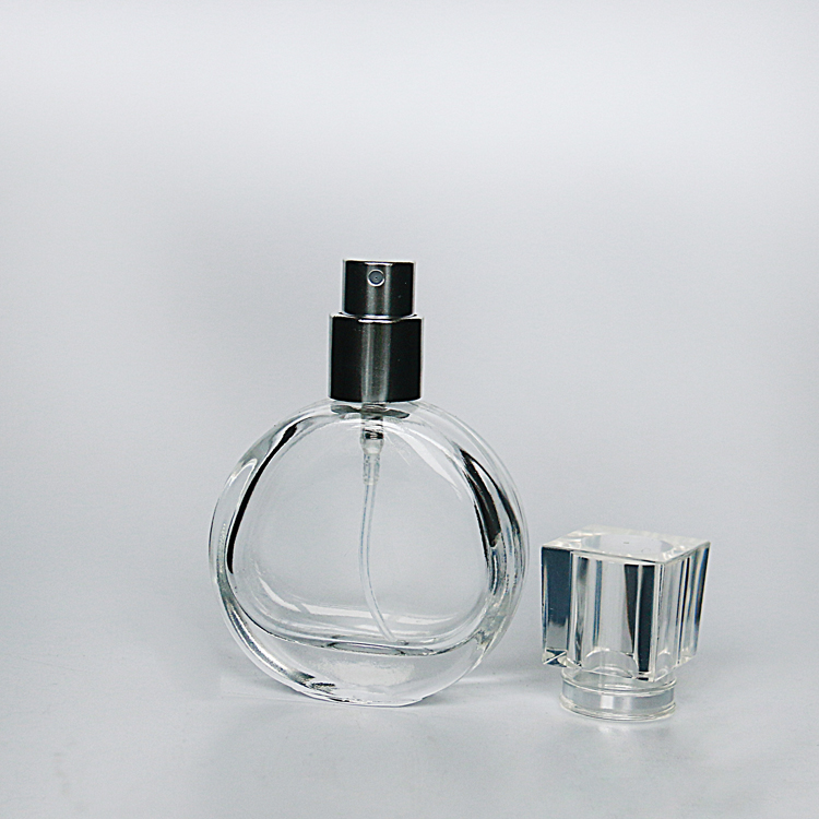 Wholesale Luxury 30ml 50ml Clear Empty Round Shaped Glass Spray Perfume Bottle With Screw Lid