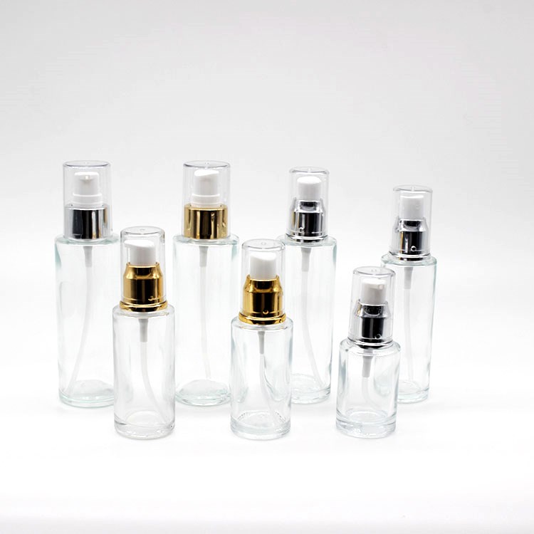 Wholesale Mini Cylinder Cosmetic Transparent Spray Packaging Bottles Empty Skin Care Serum Lotion Pump Bottles with Pump