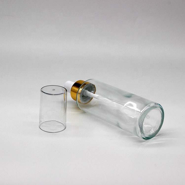 Wholesale Mini Cylinder Cosmetic Transparent Spray Packaging Bottles Empty Skin Care Serum Lotion Pump Bottles with Pump