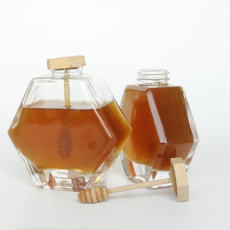 Wholesale New Design Hexagonal Honey Glass Jars For Honey Storage With Dipper Wooden Cap Spoon Inside