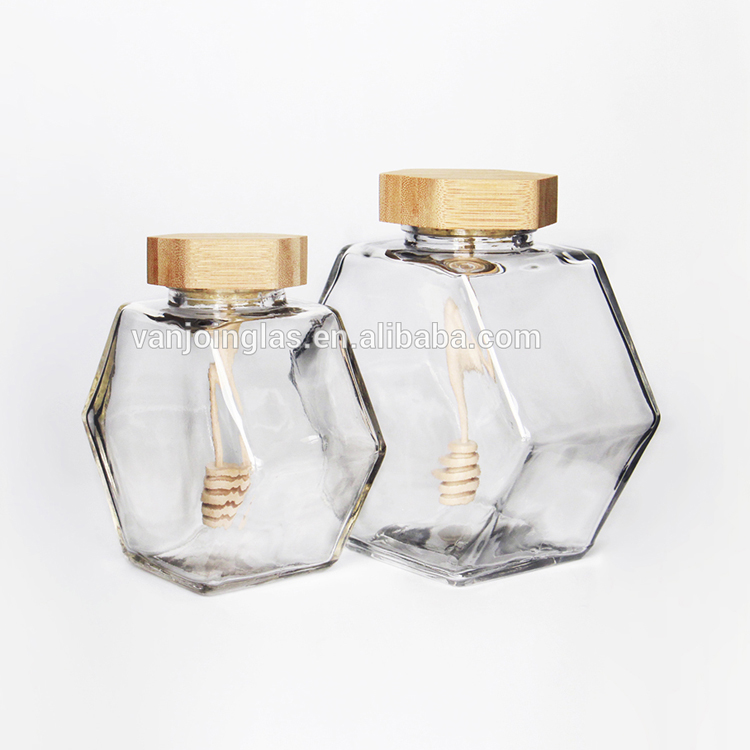 Wholesale New Design Hexagonal Honey Glass Jars For Honey Storage With Dipper Wooden Cap Spoon Inside