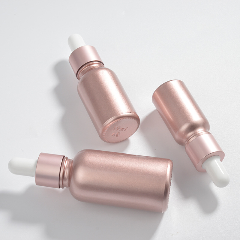 Wholesale OEM Cosmetic Rose Gold Empty Pink Glass Bottles 10ml 15ml 30ml Face Serum Essential Oil Glass Dropper Bottle