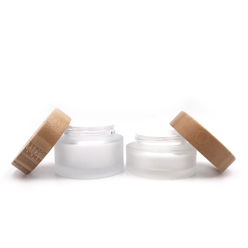 Wholesale Transparent Frosted Cosmetic Cream Container Glass Jars With Screw Bamboo Lids