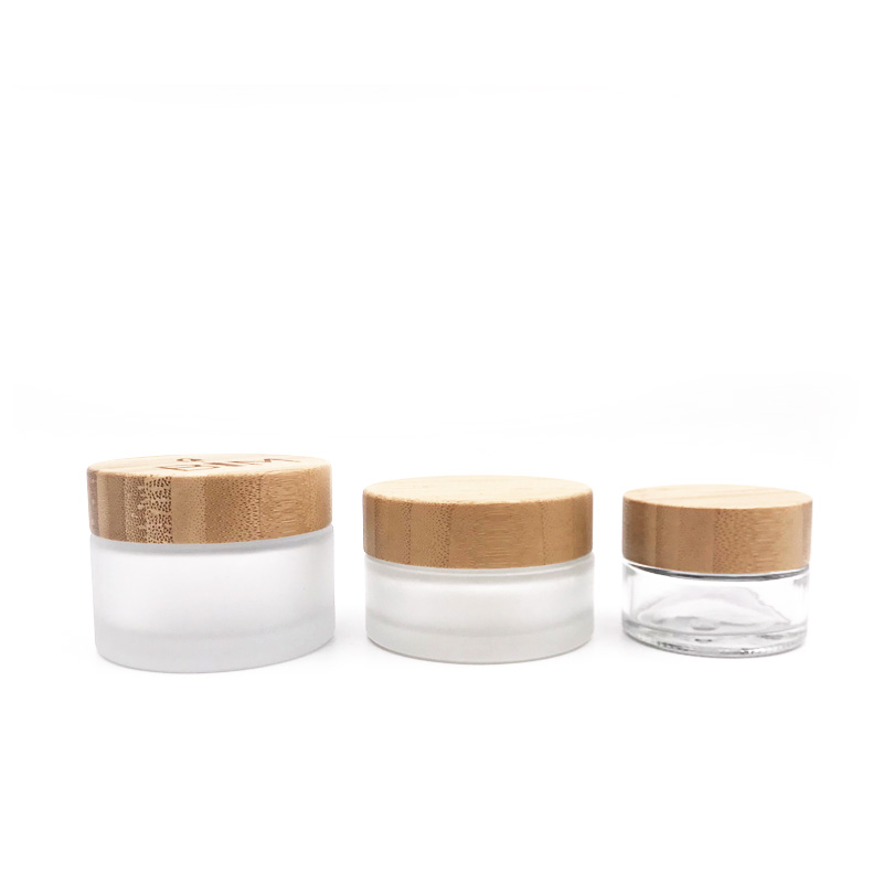 Wholesale Transparent Frosted Cosmetic Cream Container Glass Jars With Screw Bamboo Lids