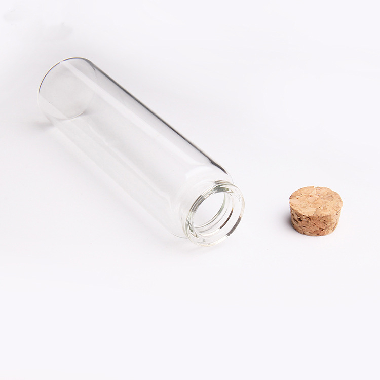 Wholesale Transparent long neck small glass bottle with cork round lid packing 55ml