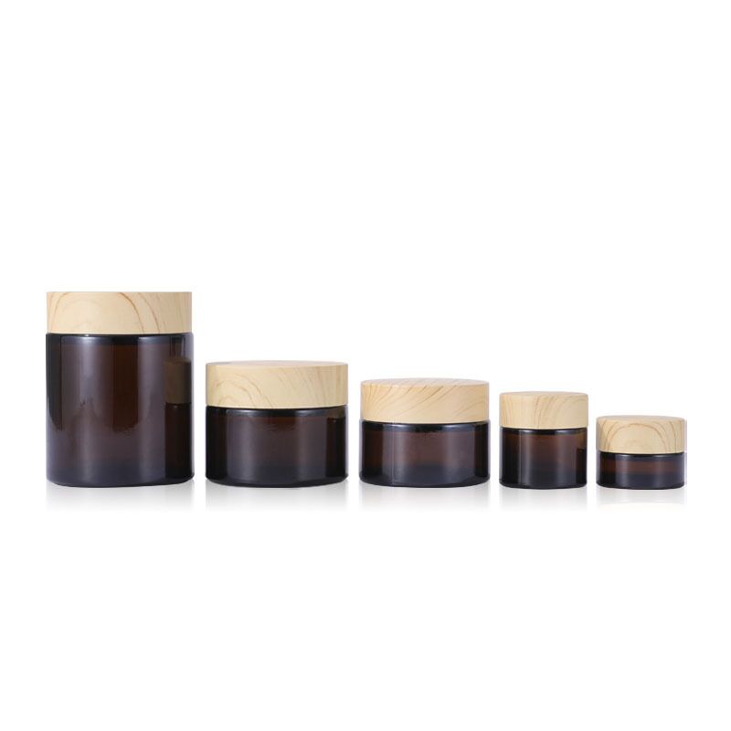 Wholesale amber 5g 10g 30g 50g 100g glass cosmetic jar bottle wood grain cover