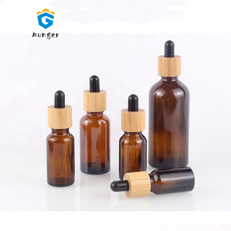 Wholesale amber glass bottles 10ml 15ml 20ml 30ml 50ml 100ml glass dropper bottles with bamboo cap