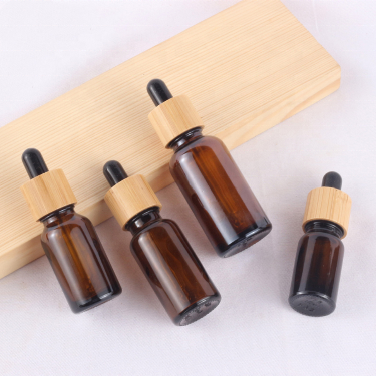 Wholesale amber glass bottles 10ml 15ml 20ml 30ml 50ml 100ml glass dropper bottles with bamboo cap