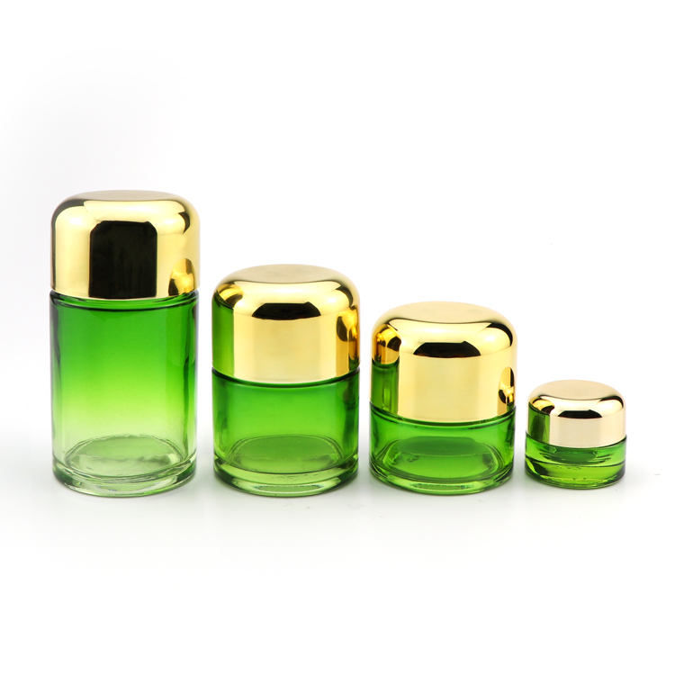 Wholesale bulk 5ml 50ml 70ml 110ml clear green glass herb storage jars with childproof gold cap