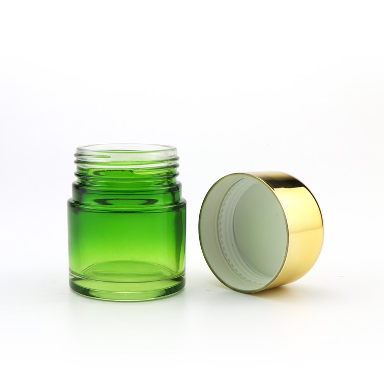 Wholesale bulk 5ml 50ml 70ml 110ml clear green glass herb storage jars with childproof gold cap