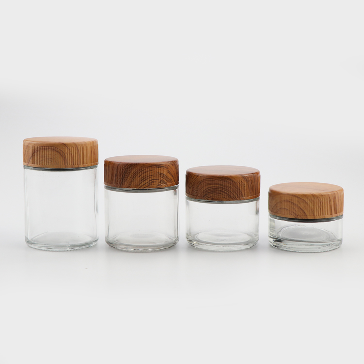 Wholesale canada 1oz 2oz 3oz 4oz CR flush cap clear empty air tight medical glass container jars with plastic wood lid
