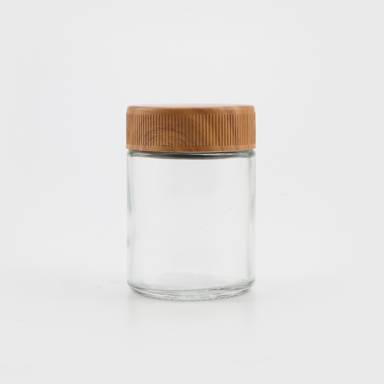 Wholesale canada 1oz 2oz 3oz 4oz CR flush cap clear empty air tight medical glass container jars with plastic wood lid
