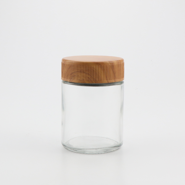 Wholesale canada 1oz 2oz 3oz 4oz CR flush cap clear empty air tight medical glass container jars with plastic wood lid