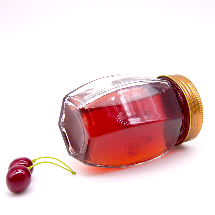 Wholesale cheap hexagon food storage empty honey bee glass jar for canning with metal lid