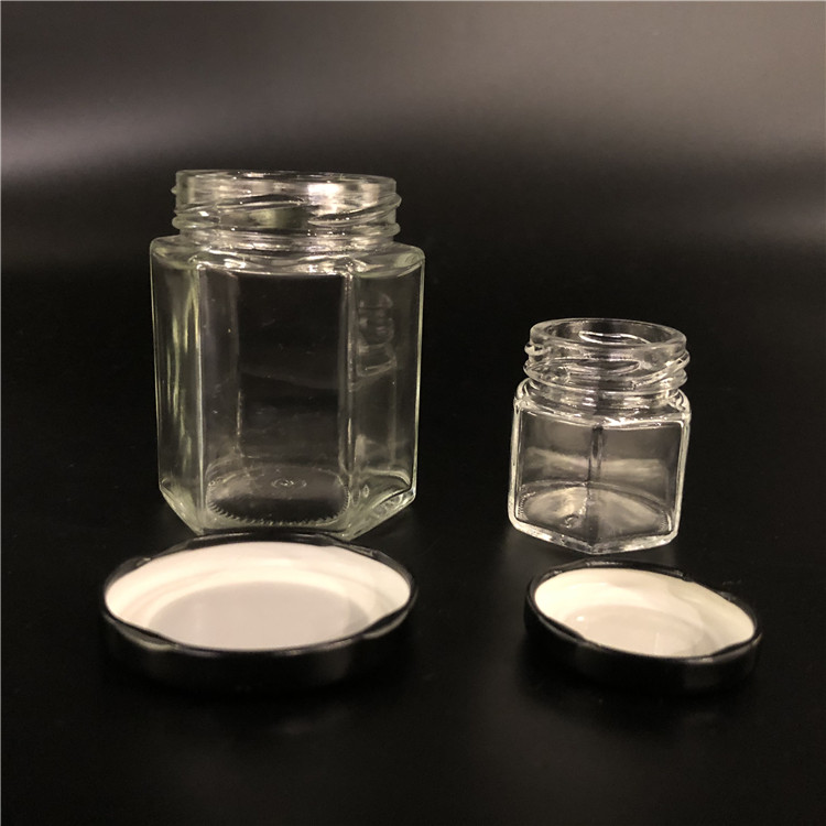 Wholesale cheap hexagon food storage empty honey bee glass jar for canning with metal lid