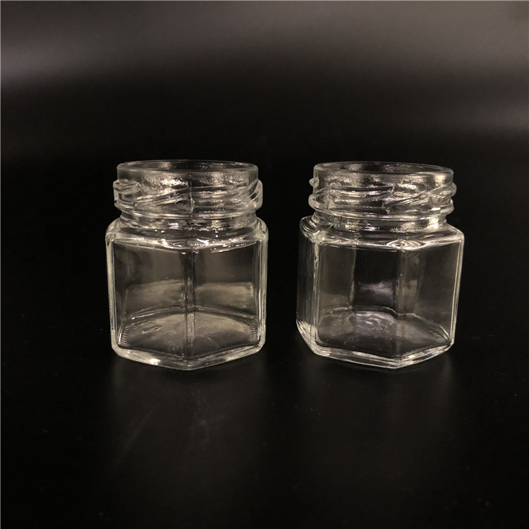 Wholesale cheap hexagon food storage empty honey bee glass jar for canning with metal lid