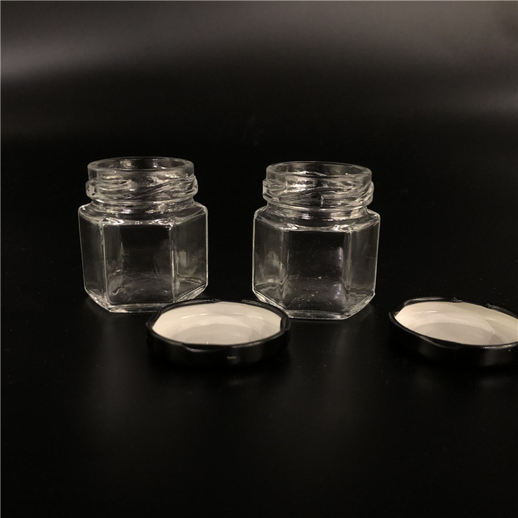 Wholesale cheap hexagon food storage empty honey bee glass jar for canning with metal lid