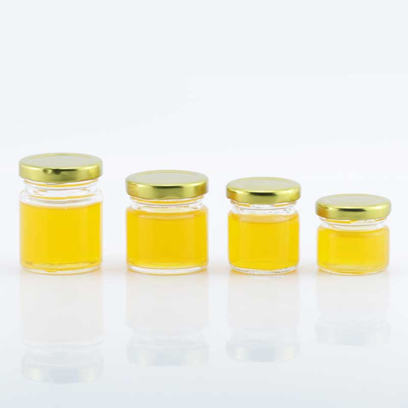 Wholesale classic 30ml 40ml 60ml 80ml mini clear round honey glass jar jam jar with metal top lid