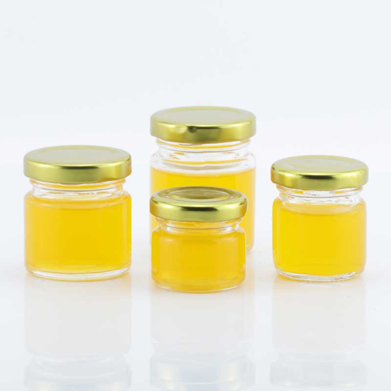 Wholesale classic 30ml 40ml 60ml 80ml mini clear round honey glass jar jam jar with metal top lid