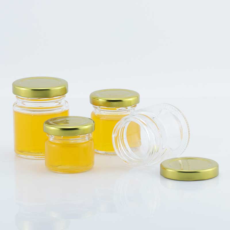 Wholesale classic 30ml 40ml 60ml 80ml mini clear round honey glass jar jam jar with metal top lid