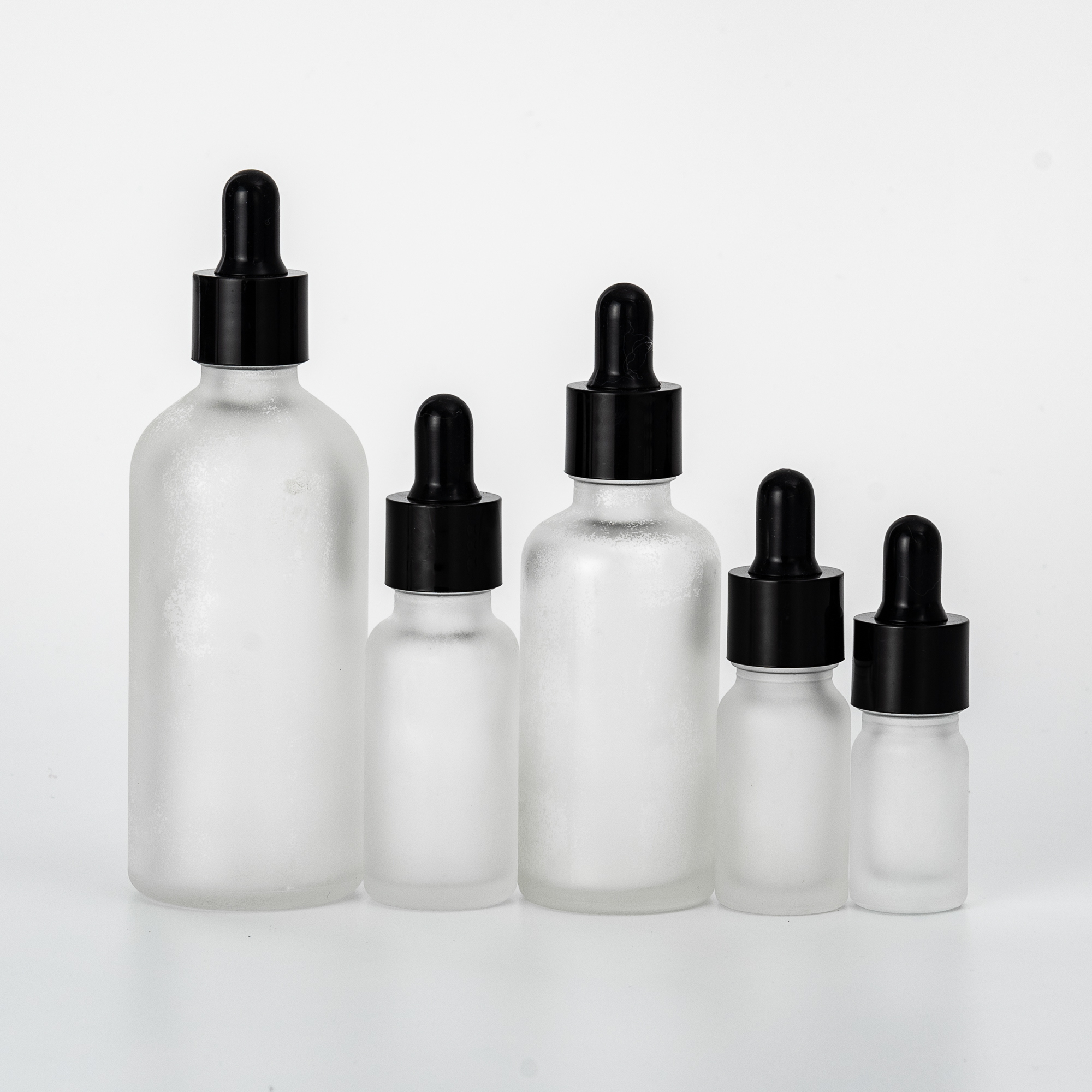 Wholesale clear frosted glass essential oil bottle with black plastic dropper for skincare 5ml 10ml 18ml 20ml 50ml 100ml