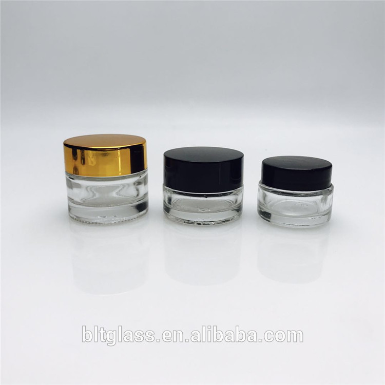 Wholesale cosmetic 4 oz glass container glass cosmetic jars and bottles with black gold plastic caps