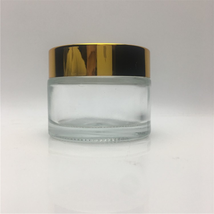 Wholesale cosmetic 4 oz glass container glass cosmetic jars and bottles with black gold plastic caps