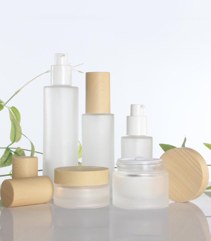 Wholesale cosmetic bottle glass jars skin care packaging set frost cream jars and spray lotion bottles with bamboo lid