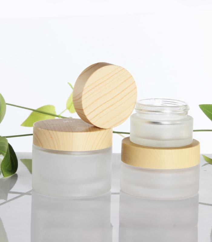 Wholesale cosmetic bottle glass jars skin care packaging set frost cream jars and spray lotion bottles with bamboo lid