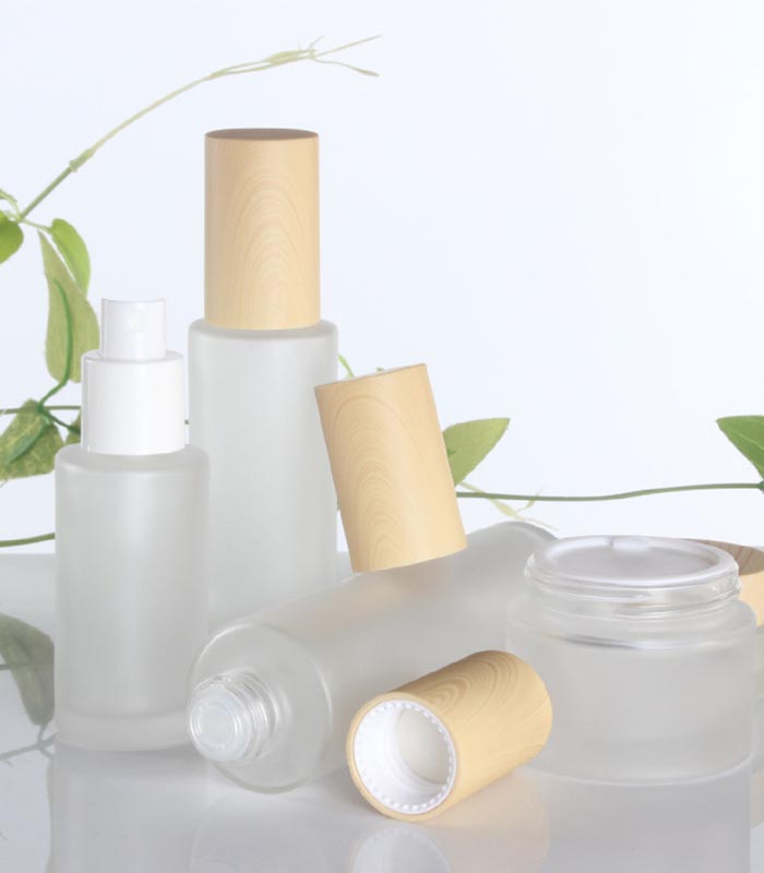 Wholesale cosmetic bottle glass jars skin care packaging set frost cream jars and spray lotion bottles with bamboo lid