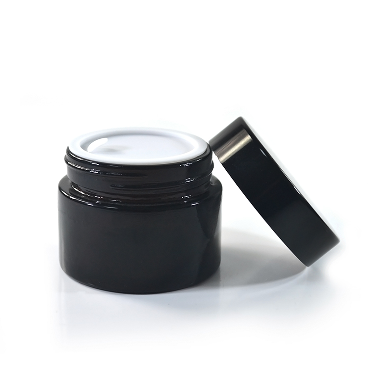 Wholesale cosmetic containers cream packaging 100g amber glass cream jars with black anodized aluminum lid